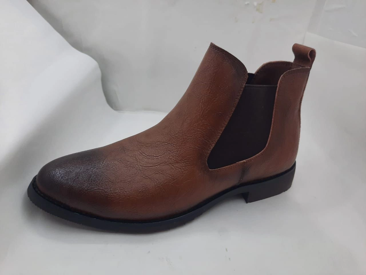 https://s3.vistaartrade.com/vistaartrade/media/products/2022/09/11/Dark_Brown_Dual_Shade_Boots.webp
